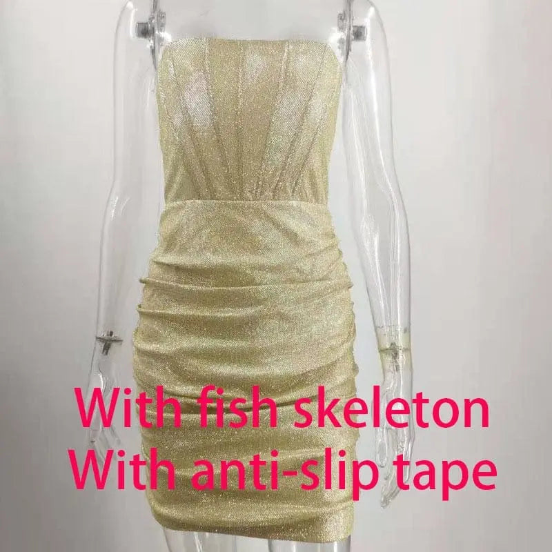 The Giyu Night Club Party Woman Dress is a sexy, strapless, glitter bodycon mini dress in black with elegant ruching. Displayed on a mannequin, it's perfect for summer parties and club nights in 2023.