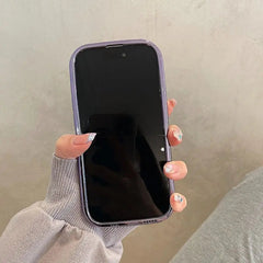 A hand holds a smartphone featuring a glossy purple meteorite texture plating case.