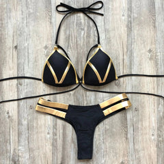 A black bikini set featuring gold stamping details on the triangle top and side-strap bottoms.