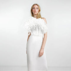 A sleeveless white maxi dress featuring a 3D floral neckline and a slim, elegant silhouette.