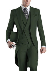 A man wearing a slim-fit, dark green three-piece tuxedo with a peaked lapel and top hat.