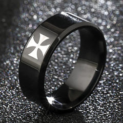 A black titanium steel ring featuring a silver-toned cross emblem on a polished band.