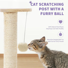 A cat plays with a hanging fuzzy ball attached to a sisal-wrapped wooden scratching post.