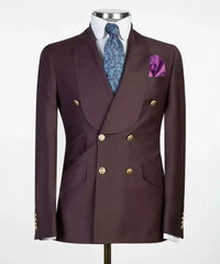 A dark burgundy double-breasted suit jacket with gold buttons, a shawl collar, and a pocket square.