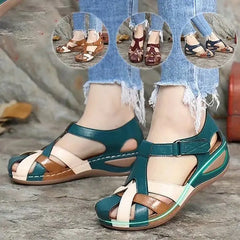 Women's casual wedge sandals featuring a multi-colored patchwork design and an ankle strap.