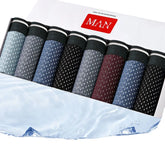 A set of eight men's boxer briefs in assorted colors with a dotted pattern and elastic waistbands.