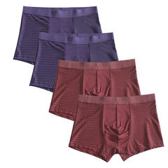 A set of four men's boxer shorts in purple and maroon with a breathable mesh patchwork design.