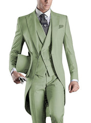 A man wearing a slim-fit, light green three-piece tuxedo with a peaked lapel and top hat.