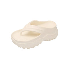 A pair of cream-colored, thick-soled EVA flip-flops with a rounded toe and platform design.