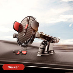 A black car phone holder with a suction cup base mounted on a dashboard.