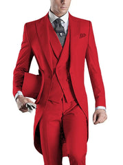 A man wears a slim-fit red three-piece tuxedo with a peaked lapel and a patterned tie.