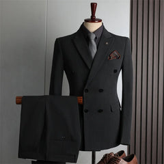 A charcoal grey double-breasted suit with a matching pair of trousers on a mannequin.
