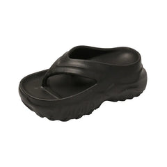 A pair of black, thick-soled EVA flip-flops with a rounded toe and a chunky, textured platform.