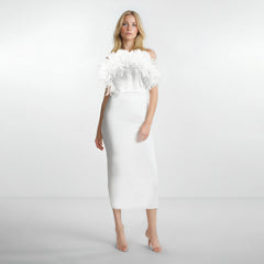 A woman wears a white sleeveless midi dress featuring a 3D floral neckline.