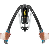 A person holds an adjustable hydraulic arm exercise machine with black handles and a central dial.