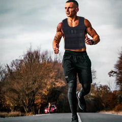 A man wearing a black adjustable weighted vest while running outdoors.