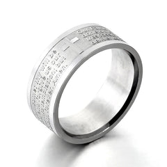 A silver-toned stainless steel ring engraved with the Lord's Prayer and a central cross.