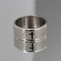 A silver-toned titanium steel ring featuring an engraved Christian cross and Bible verse text.