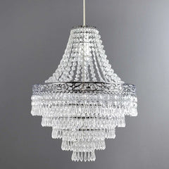 A tiered acrylic chandelier pendant shade featuring clear hanging droplets and a chrome frame.