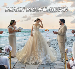 A bride wears a floor-length, A-line lace ball gown with a scoop neckline on a beach.