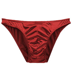 A pair of red men's briefs made from a smooth, shiny satin fabric.