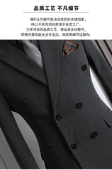 A charcoal grey double-breasted men's suit jacket with a notched lapel and a pocket square.