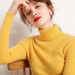 A woman wears a bright yellow, slim-fit ribbed turtleneck sweater with long sleeves.