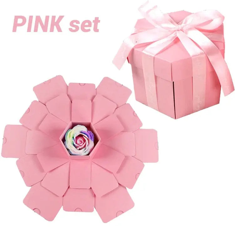The Hexagon Explosion Box Scrapbook Album in pink features a ribbon, petal-shaped flaps, and a vibrant artificial rose. "PINK set" appears at the top left. Ideal as a DIY scrapbook or unique photo album gift.