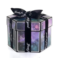 A Hexagon Explosion Box Scrapbook Album with a galaxy theme, wrapped in a black "Just for you" ribbon tied in a bow—a unique photo album gift perfect for capturing memorable moments.