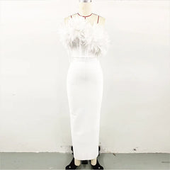 A sleeveless white maxi dress featuring a slim silhouette and 3D floral embellishments at the neck.