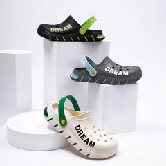 Three pairs of colorful, thick-soled EVA clogs with the word DREAM printed on the side.