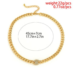 The Ingemark Iced Out Rhinestones Tennis Chain Pendant Choker Necklace features a gold curb chain, round CZ centerpiece, measures 45cm+7cm extender (17.7in+2.7in), and weighs 22g (0.77oz)—trendy hip hop steampunk bling for men.