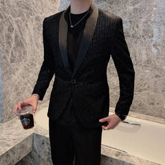 A man wears a slim-fit black sequined striped blazer with a shawl collar and a single button.