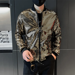 A man wears a gold, diamond-patterned bomber jacket with a black stand collar and zipper closure.