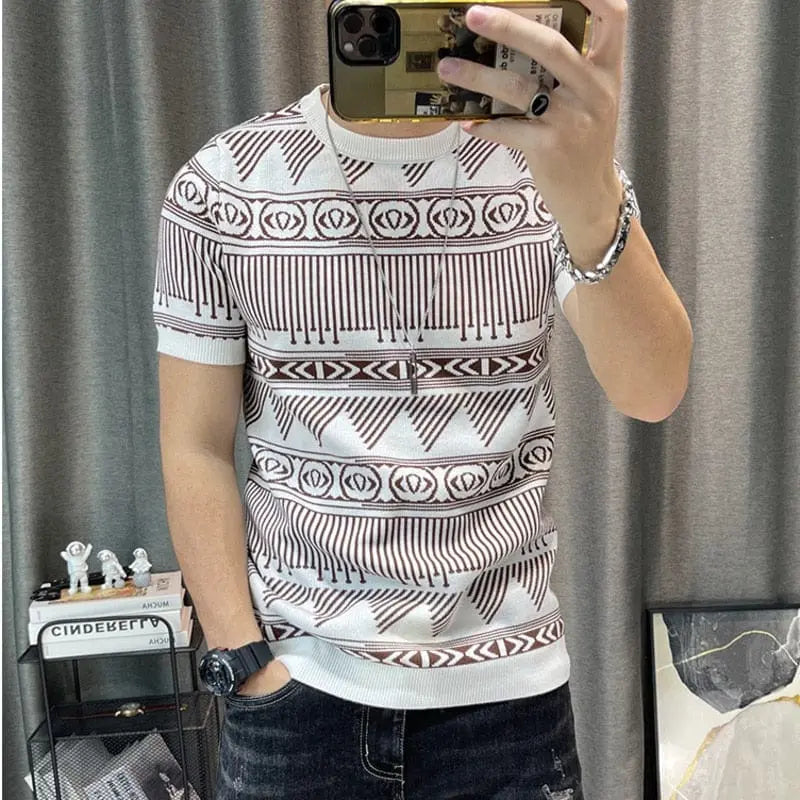 A person wears the Korean Slim Bottomed Shirt, a thick O-neck striped short sleeve streetwear knitted tee, taking a mirror selfie. In the background, there's a shelf with figurines and a framed picture on the floor.
