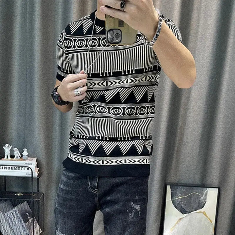 A person takes a mirror selfie wearing the Korean Slim Bottomed Shirt, a top-quality thick O-neck stripe short sleeve streetwear T-shirt, paired with dark jeans. The background features shelves with figurines, books, and a framed picture by a gray curtain.
