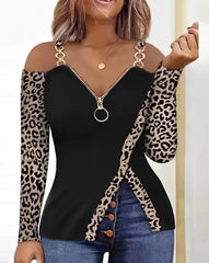 A long-sleeve cold-shoulder top with a leopard print, front zipper, and split hem.