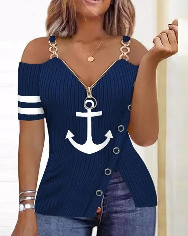A navy blue cold shoulder top with a white anchor print, front zipper, and side button detail.