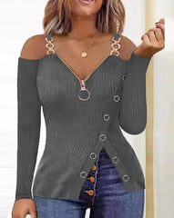 A grey long-sleeve cold-shoulder top with a front zipper and decorative side buttons.