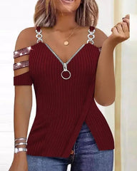 A maroon ribbed cold-shoulder top with a front zipper, rhinestone sleeve straps, and a split hem.