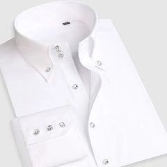 A white long-sleeve button-down shirt with a pointed collar and decorative metallic buttons.