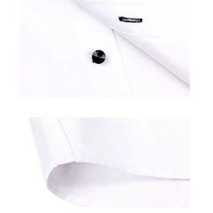 Close-up of a white long-sleeved dress shirt featuring a black button and a pointed collar.