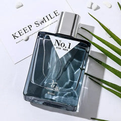 A rectangular bottle of No.1 cologne for men with dark blue liquid on a white surface.