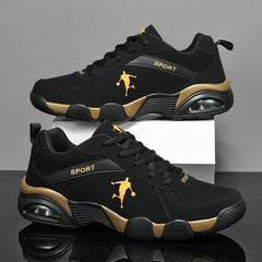 A pair of Men's Sneakers 2022 New Lightweight Vulcanized Shoes with anti-skid soles, breathable black mesh, gold accents, "SPORT" text, and a gold soccer silhouette on the sides. Lace-up design shown against a gray background.