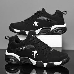 Men's Sneakers 2022: Black mesh lace-up sneakers with white soles and accents, featuring a soccer player silhouette on the side. Lightweight, anti-skid, breathable shoes for men shown against a gray and white background.
