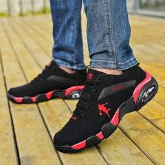 A person wearing blue jeans and Men's Sneakers 2022 New Lightweight Men Vulcanized Shoes stands on a wooden deck.