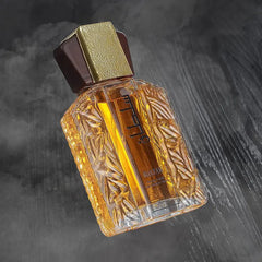 A 100ml bottle of Sultan perfume with a textured glass body and a dark brown and gold cap.