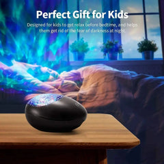 The Music Voice Star Projector Ocean Wave Ceiling Night Light sits on a table, casting 7 color-changing lights and ocean waves onto the bedroom wall and ceiling. Text above says, "Perfect Gift for Kids," helping children relax at bedtime.