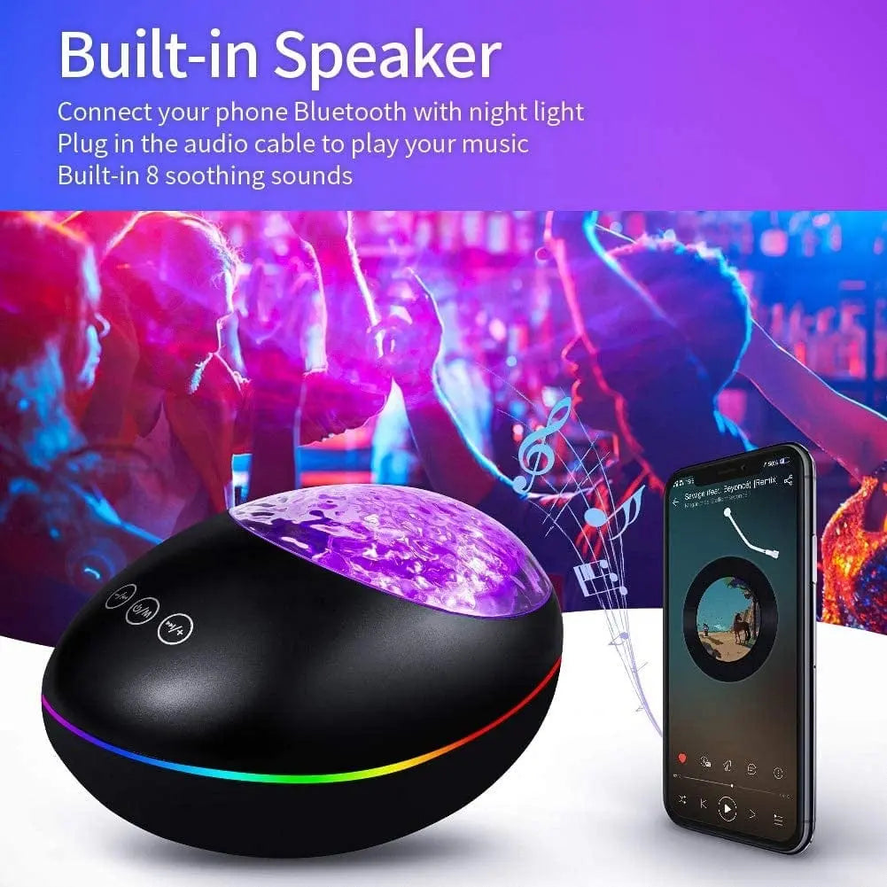 The Music Voice Star Projector Ocean Wave Ceiling Night Light glows with 7 color effects and a galaxy display. It features a built-in speaker, Bluetooth, night light functions, and 8 soothing sounds for relaxing or bedtime.