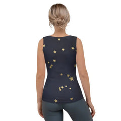 A woman wears a navy blue tank top featuring a scattered gold star pattern.